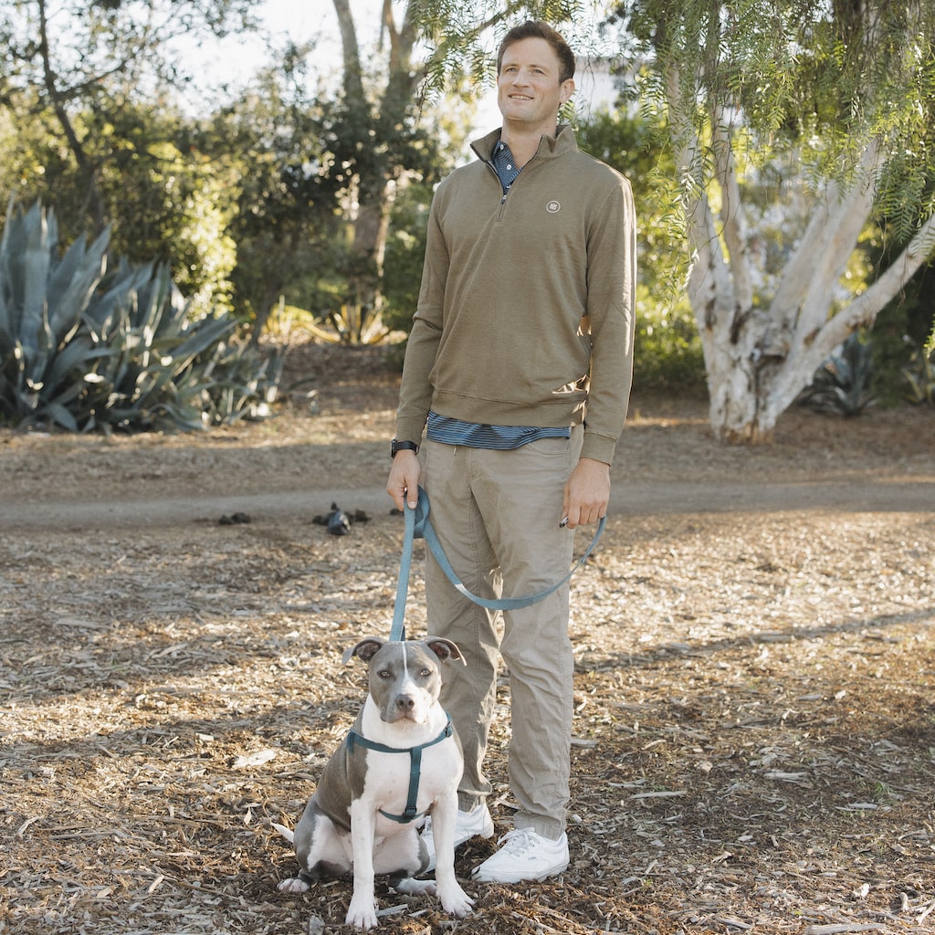 This black and khaki striped quarter zip style outerwear piece features a buttery material.