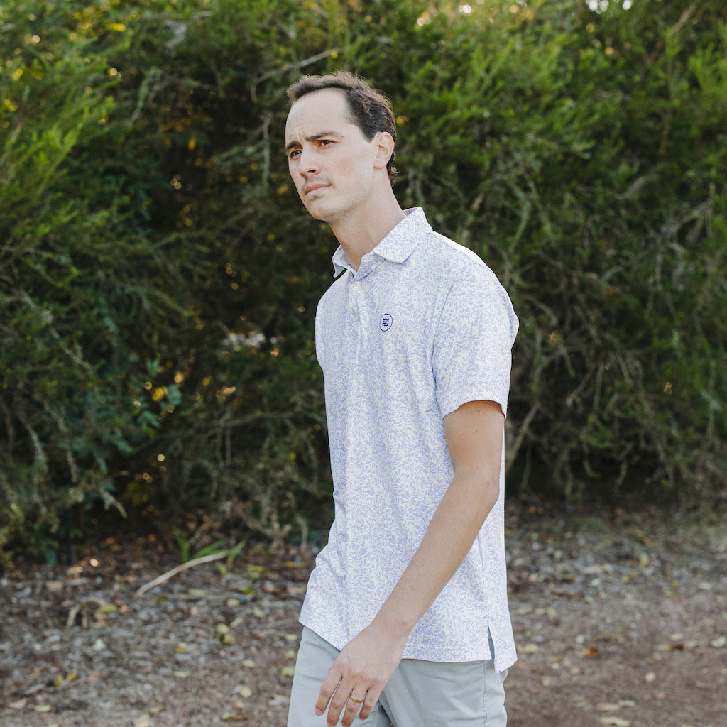 The Lilac Polo is a floral performance golf polo with an elevated material and aesthetic to up your style. The soft purple and yellow floral print flatters all.