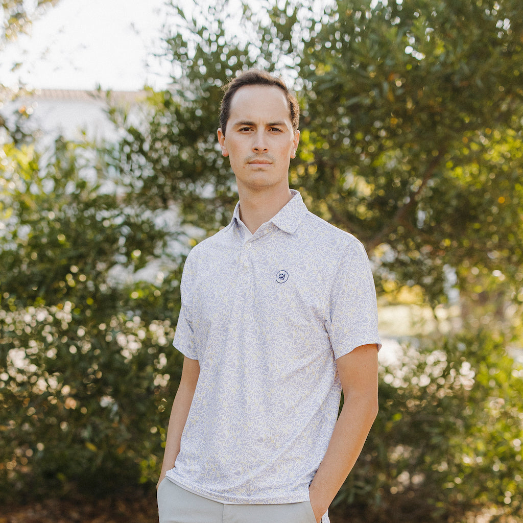 The Lilac Polo is a floral performance golf polo with an elevated material and aesthetic to up your style. The soft purple and yellow floral print flatters all.