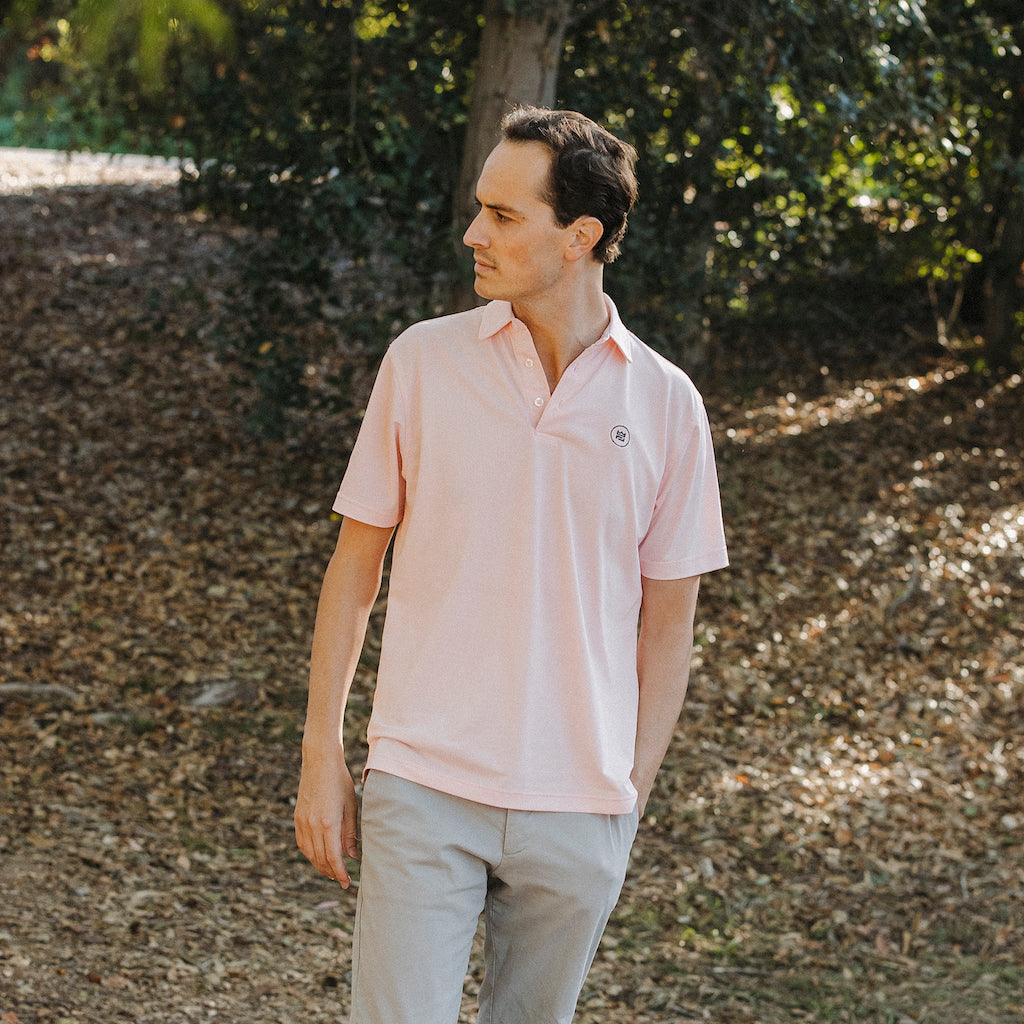 The Lion & Lamb Co. solid colored Salmon Polo features a breezy pique material and a sport fit.