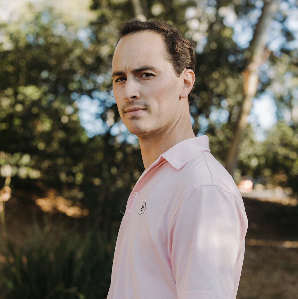 The Lion & Lamb Co. solid colored Salmon Polo features a breezy pique material and a sport fit.