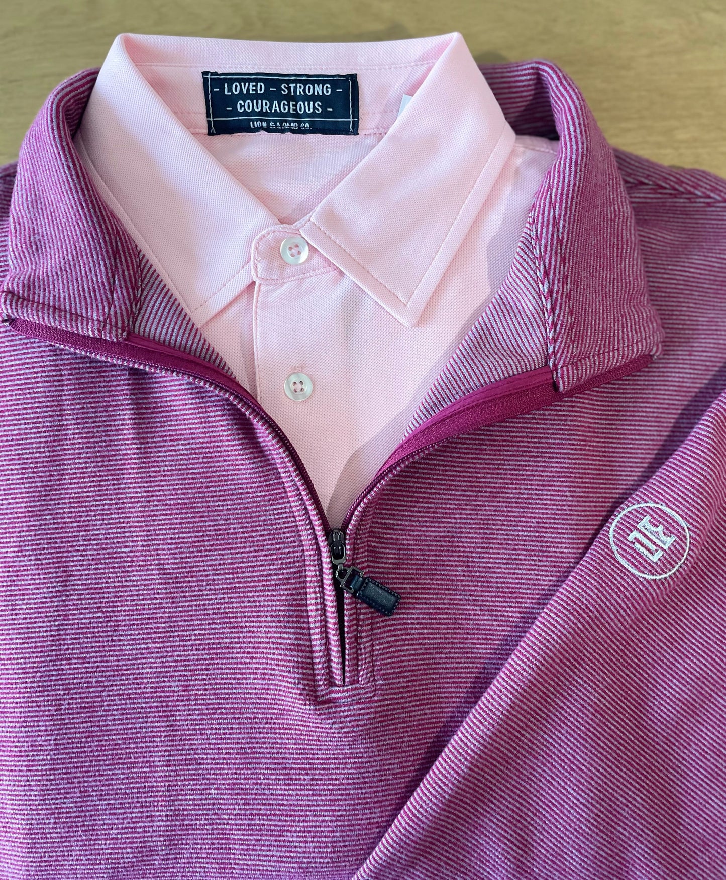 The Crimson Quarter Zip features a warm red and subtle silver stripe combination. It's breathability and stretch properties provide optimal mobility.