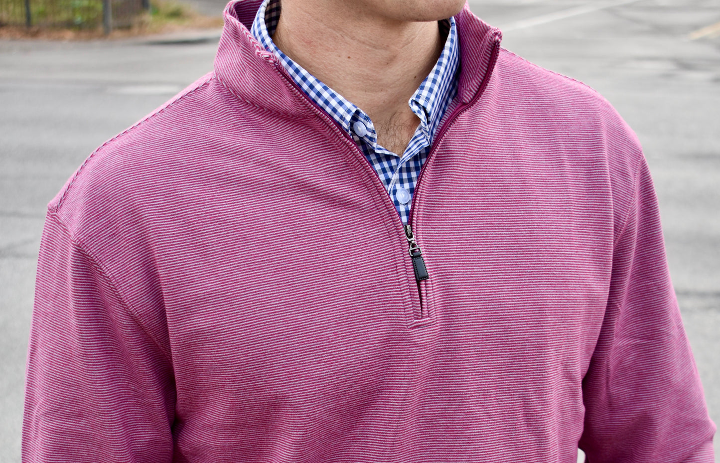 The Crimson Quarter Zip features a warm red and subtle silver stripe combination. It's breathability and stretch properties provide optimal mobility.
