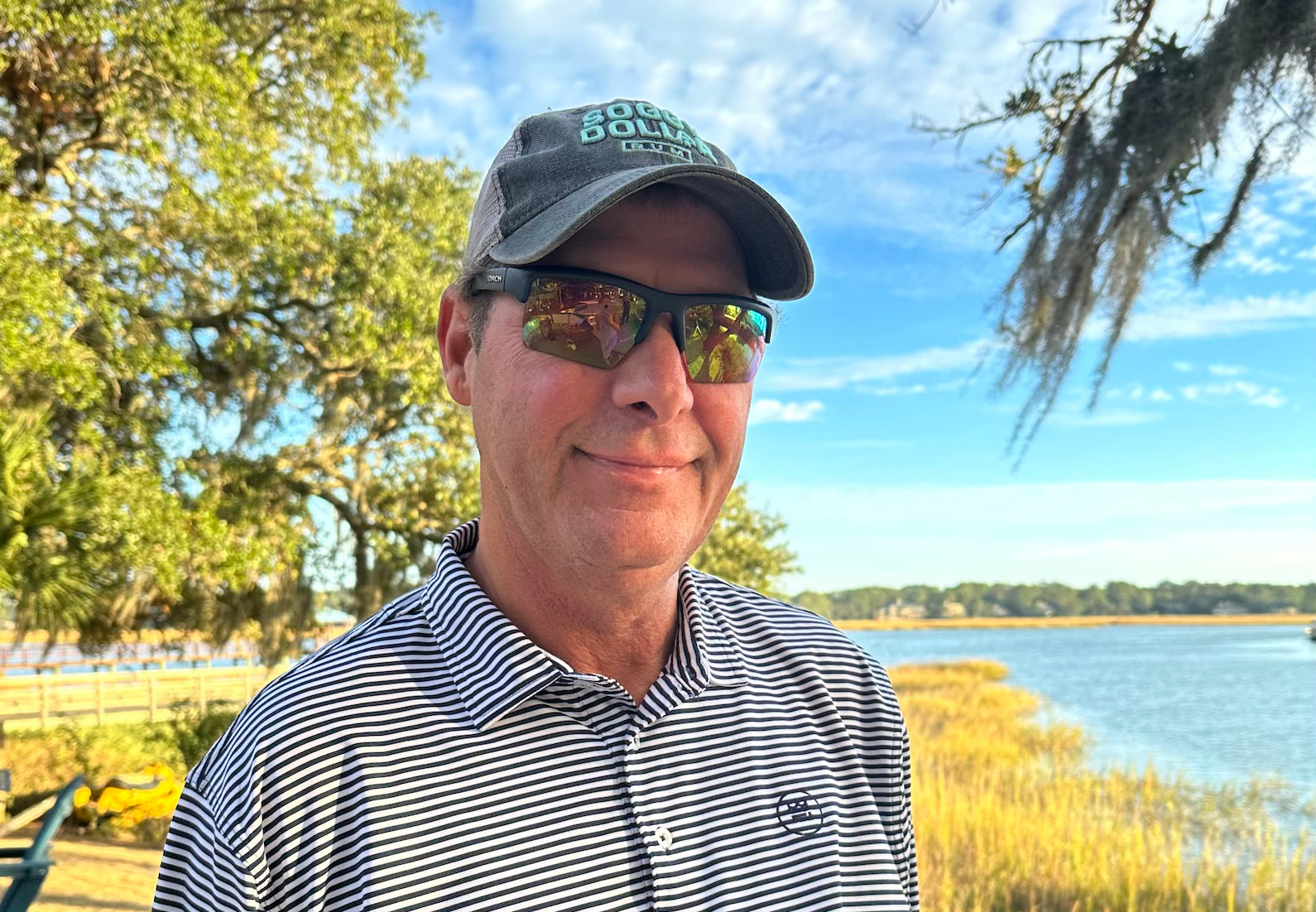 Our friend Larry wearing the classic Daniel Polo in Regal, offering a timeless combination of white and navy stripes. A classic golf polo.